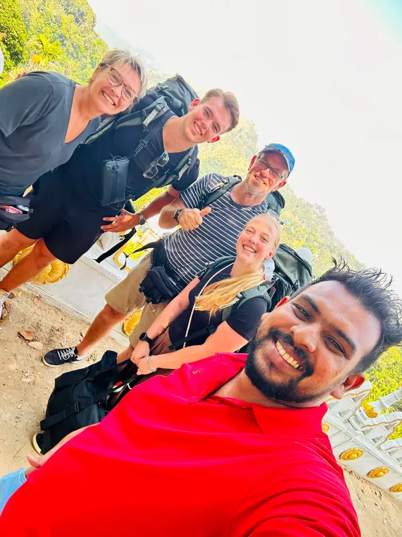 Satisfied clients arriving at their Dambulla hotel after private transfer
